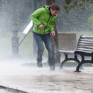 Man in heavy rain weather