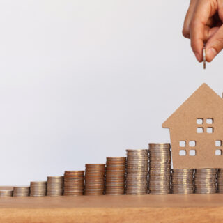 House on top of money with more being added