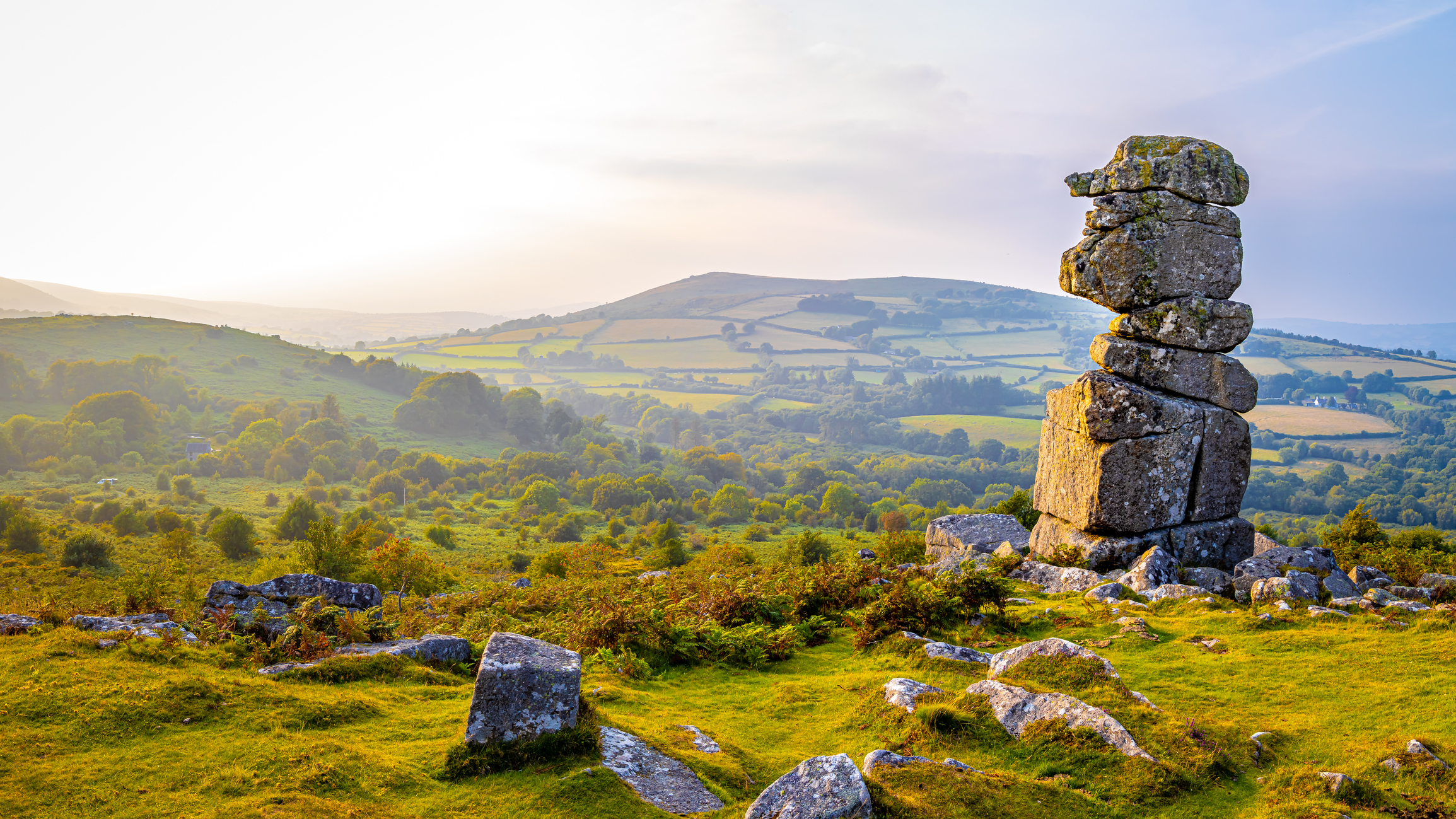 A view across Dartmoor with a standing stone to the right of the picture