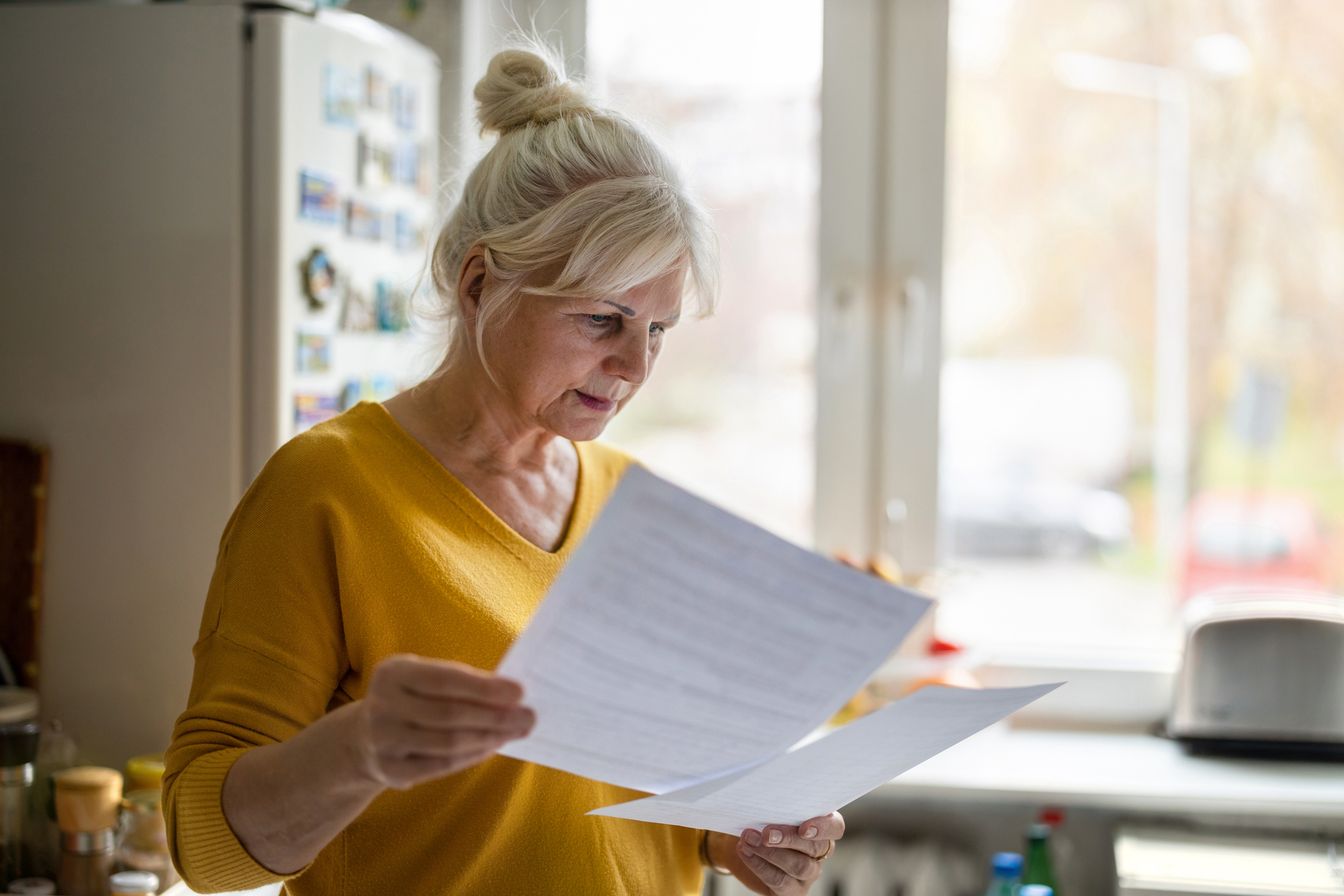 A landlord reading paper documents