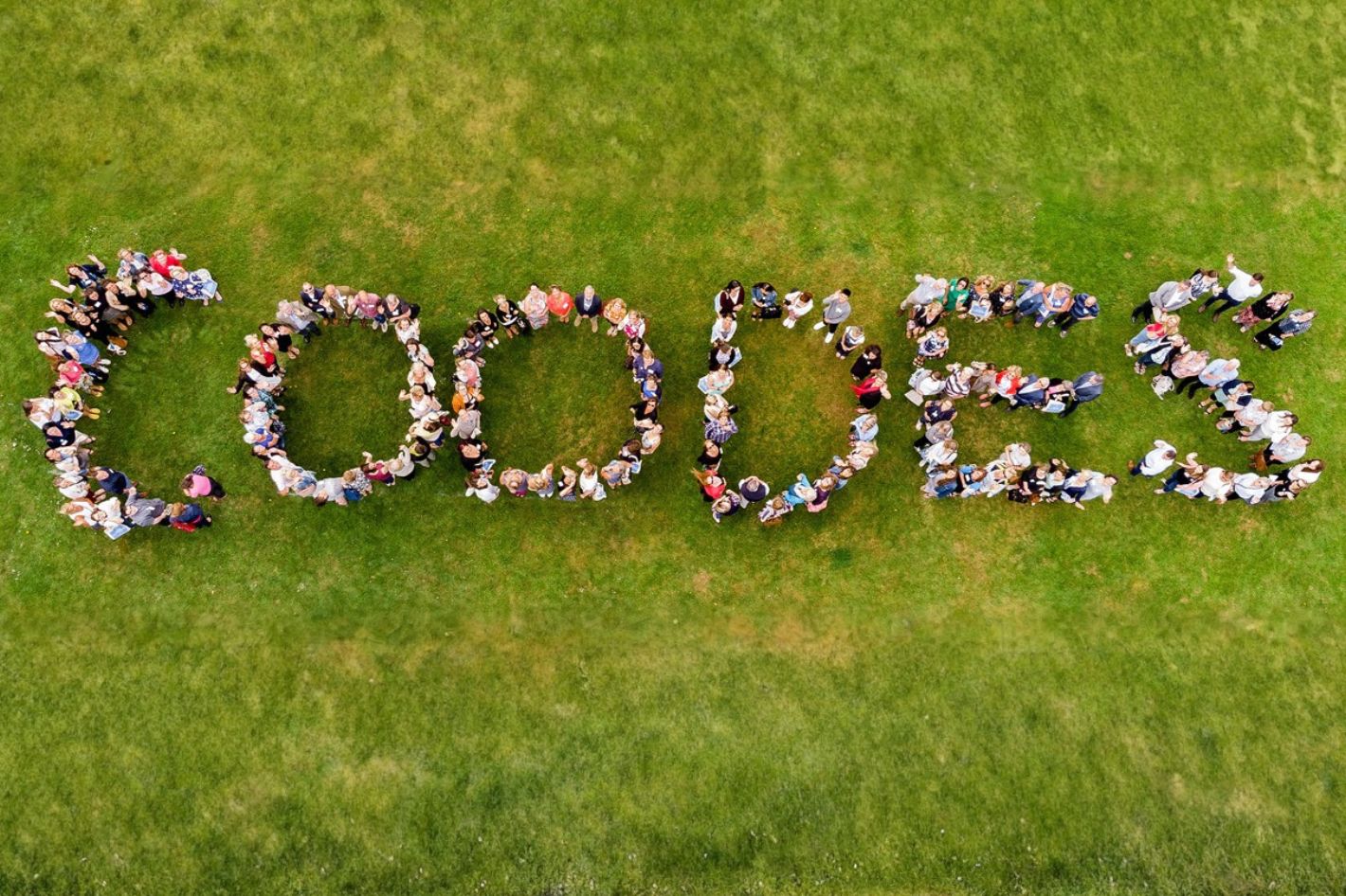 An aerial photo showing the Coodes team standing in formation to spell 'Coodes'.